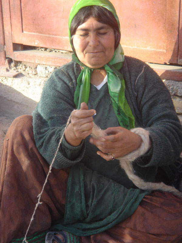 Colourful Qashqai Woman Spinning Wool